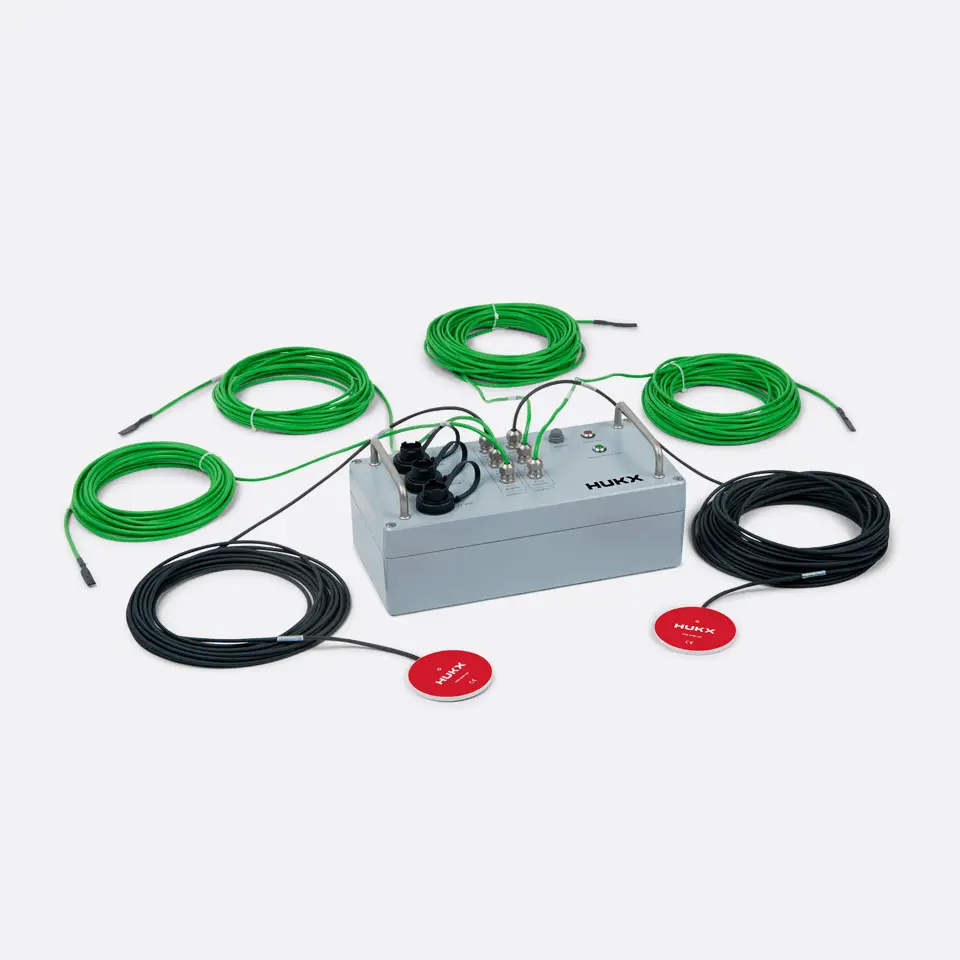 Unpacked TRSYS20 system with two HFP01 heat flux plates and high-accuracy thermocouples for in-situ building envelope R-value determination.