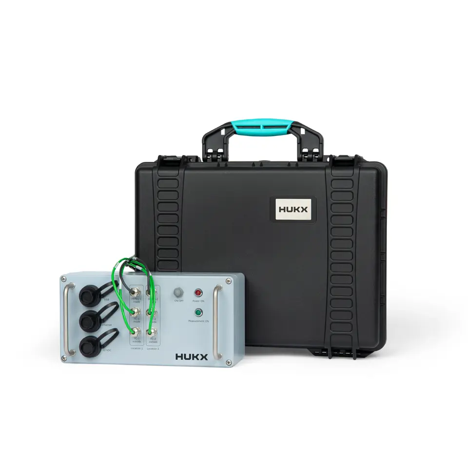 Portable TRSYS20 system with carrying case for in-situ building envelope R-value determination according to ISO 9869 standards.